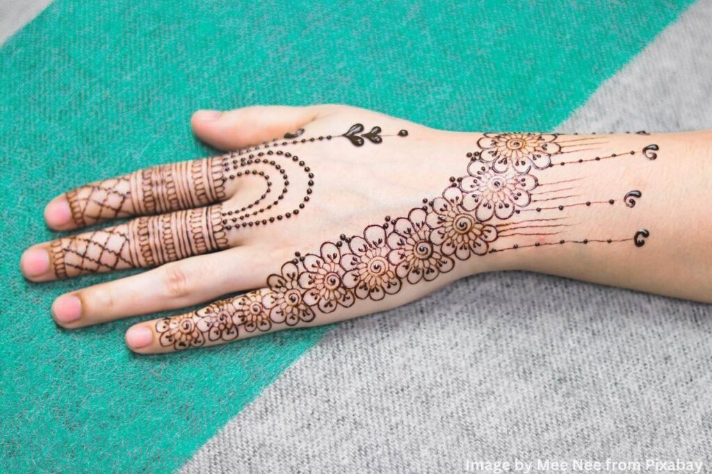lovely mehndi design on a lady hand.