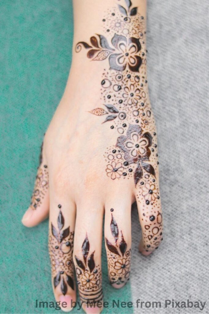 Graceful mehndi design artwork on delicate hand