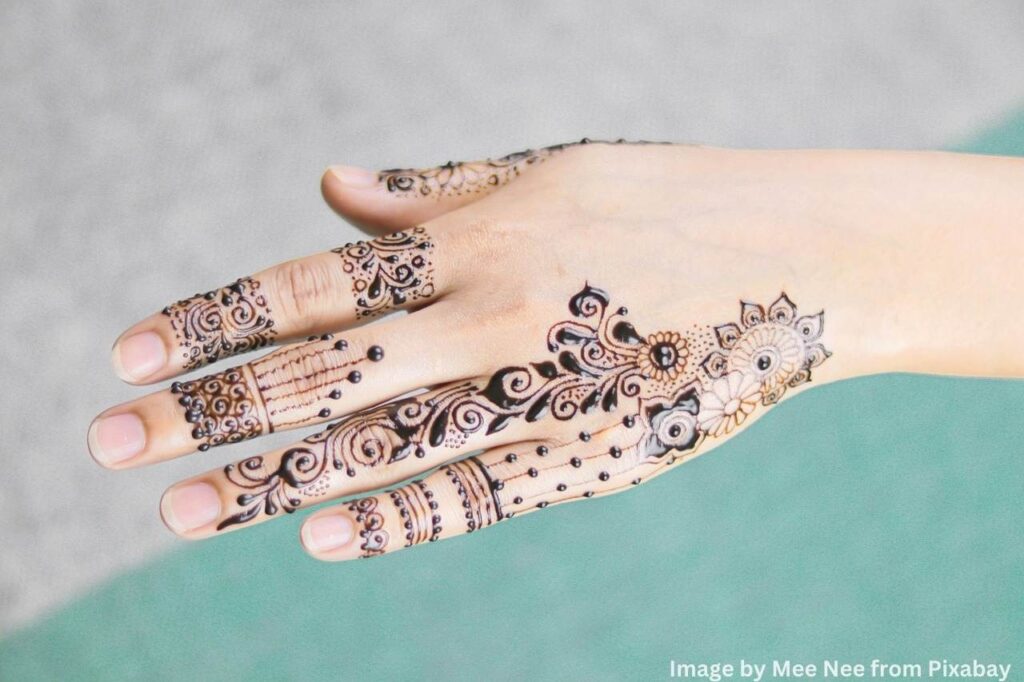 Detailed mehndi design artwork enhancing hand's beauty.