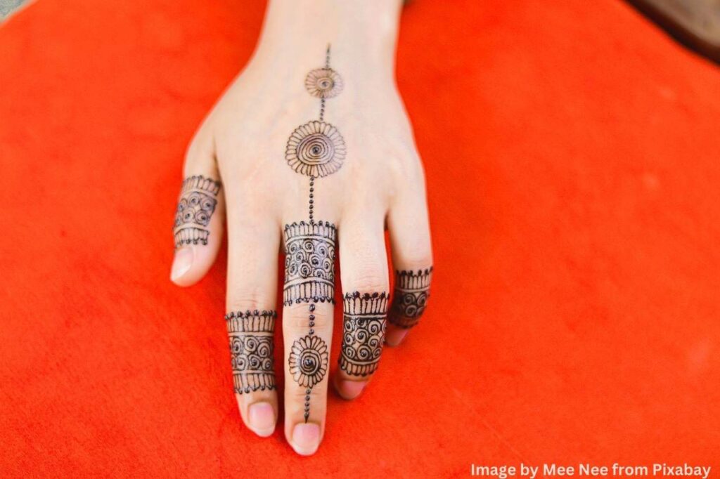 unique pattern of mehndi design on girl single hand.