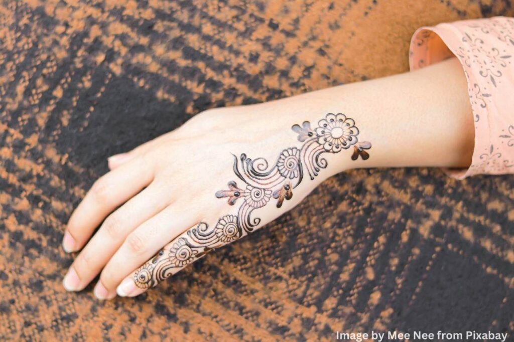 Exquisite mehndi design work on a woman's hand